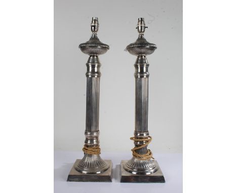 Pair of silver plated table lamps of reeded candlestick form, 60cm high, 16cm square at the bases