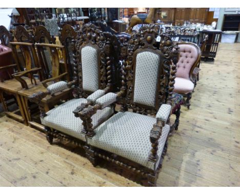 Pair carved oak panel back open armchairs having twist supports and lion mask terminals