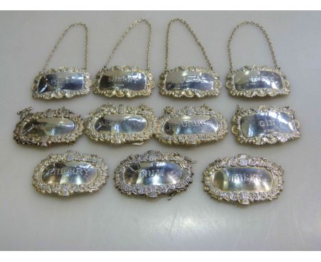Collection of eleven silver decanter labels