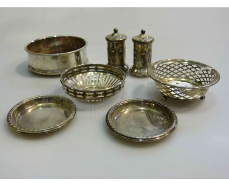 Silver coaster, two pierced silver trinket dishes, pair of silver peppers with Art Nouveau motifs, etc