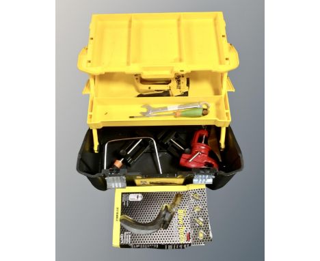 A Stanley toolbox containing assorted hand tools.
