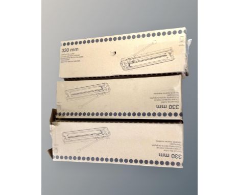 Three boxed 330mm manual tile cutters.