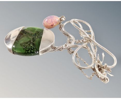 A large green glass and silver pendant on snake chain together with an opal doublet pendant on silver chain.