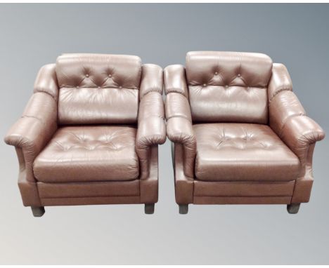 A pair of brown button leather Scandinavian armchairs 