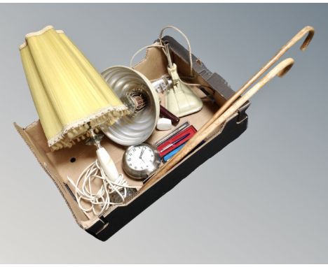 A box containing an onyx table lamp, two vintage walking sticks, enamelled Pifco infra-red heat lamp.