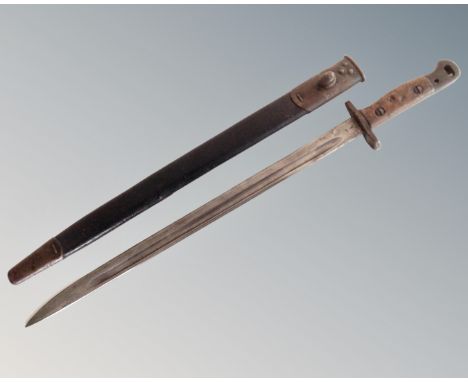 A World War I Wilkinson 1907 sword bayonet in sheath.