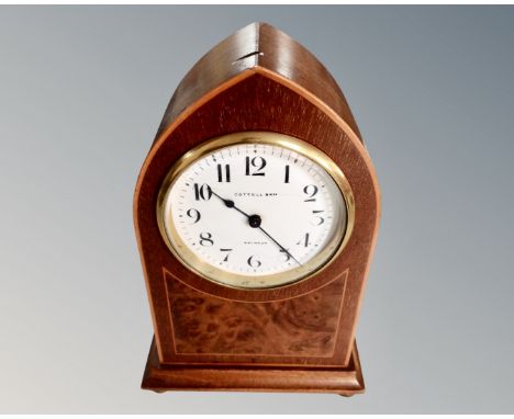 An 8 day arch-topped mantel clock, signed Cottell, Swindon. (height 23cm)