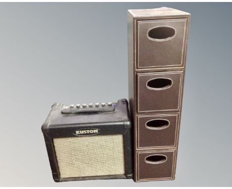 A Kustom KGA10FX guitar amplifier with lead, together with a CD chest.
