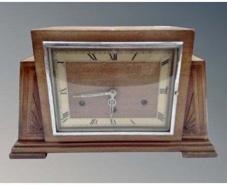 An oak Art Deco mantel clock. (width 37cm)