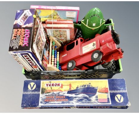 A crate containing Veron river police patrol launch construction kit, Tri-Ang model, Thunderbirds model, Atomic Arcade pinbal