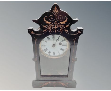 A late Victorian ebonised mantel clock. (height 36cm)