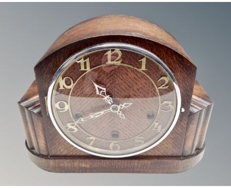 An Art Deco oak eight day mantel clock. (width 28cm)