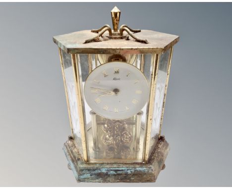 A Kundo brass mantel clock.