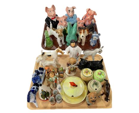 Two trays including five Wade Nat West Pigs, Sylvac rabbit, dog ornaments, Russian ornaments, four Hummel figures, Winton jam