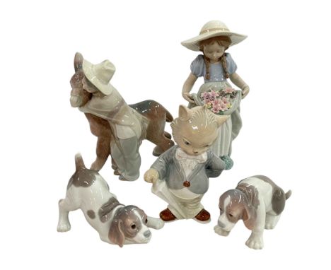 Four Lladro figures and Diseso piece.