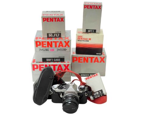 Pentax ME Super camera with accessories including 50mm FI.7 lens and 135mm F3-5 lens.