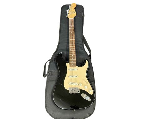 Squier by Fender electric guitar with bag.