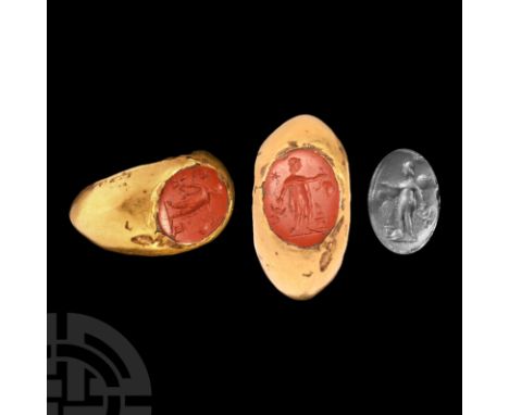 Late 2nd-early 3rd century A.D. A hollow-formed gold finger ring with inset jasper intaglio of Mercury (Hermes) standing wear