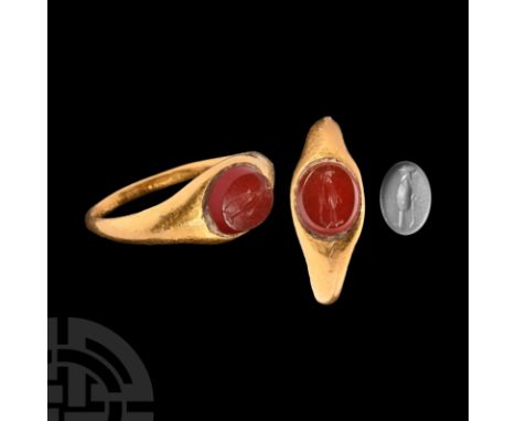 2nd century A.D. A gold finger ring with inset carnelian intaglio of a ewer or wine-jar. Cf. Chadour, A.B., Rings. The Alice 