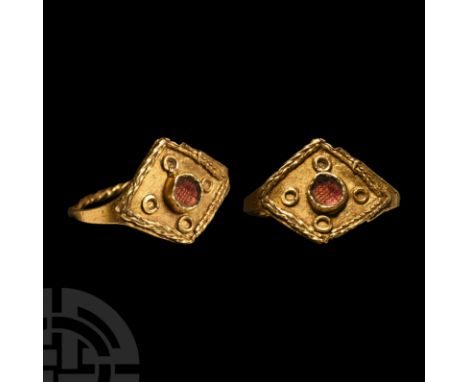 6th-7th century A.D. A gold finger ring comprising a lozengiform bezel and twisted hoop; applied filigree bilinear frame to t