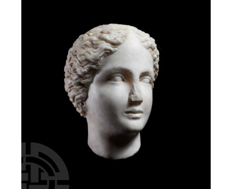 2nd century A.D. A skilfully carved life-size marble head of a female (possibly Artemis, a Muse or an Amazon) with centrally 