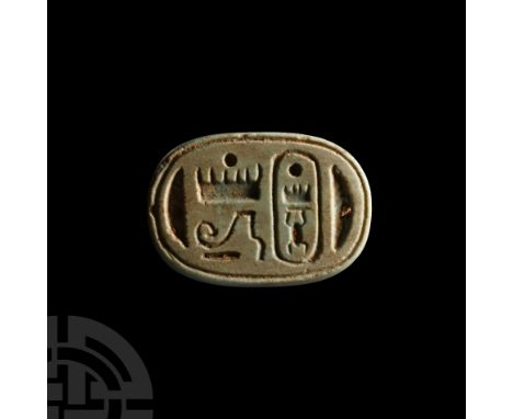 New Kingdom, 19th Dynasty, 1314-1304 B.C. A blue glazed bifacial scaraboid; one side bearing the cartouche of Thutmose III an