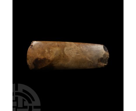 Dolman Period, 3700-3300 B.C. A very finely polished axe with square edges and convex cutting edge, in yellow-brown flint wit
