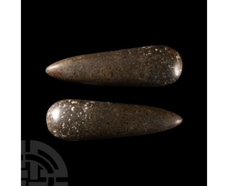 Circa 10th-4th millennium B.C. A very finely polished axe with rounded sides tapering to a pointed butt with convex cutting e