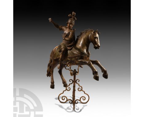 18th century A.D. A dynamic horse and mounted St George figure in wood; the helmetted rider with billowing cloak; gesso and p