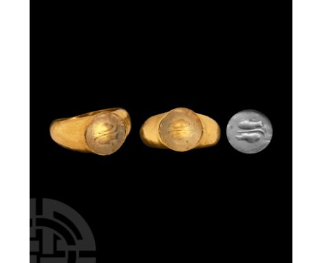 3rd-4th century A.D. A hollow-formed gold finger ring with inset glass intaglio of two fishes placed tête-bêche; the astrolog