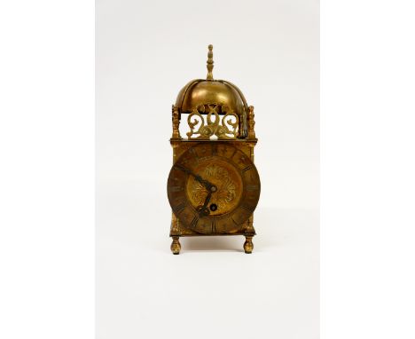 A brass lantern clock