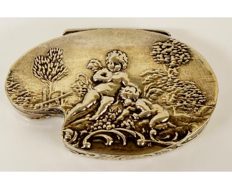 A silver snuff box shaped as an artist's palette and embossed with cherubs and foliage, scrolling foliate detail to sides, ba