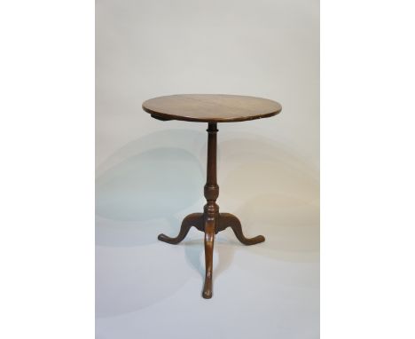 A Georgian oak round topped tripod table, 69cm high, 54cm diameter