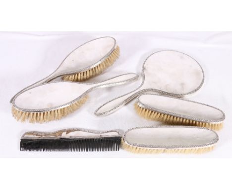 George V six piece silver vanity set with chased borders, Chester 1915 and Birmingham 1913, JDWD (John & William F Deakin).