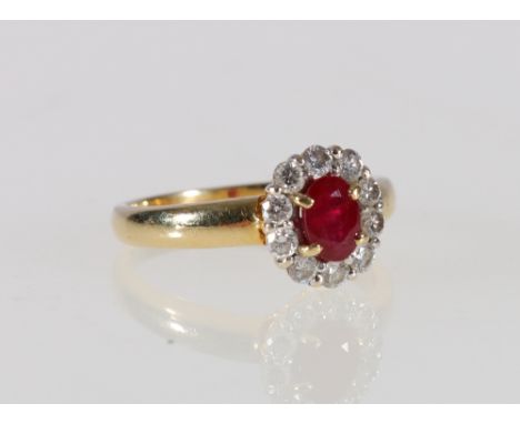 18ct yellow gold ruby and diamond ring with central faceted ruby encircled by ten round cut diamonds, size N, 4.4g.   CONDITI