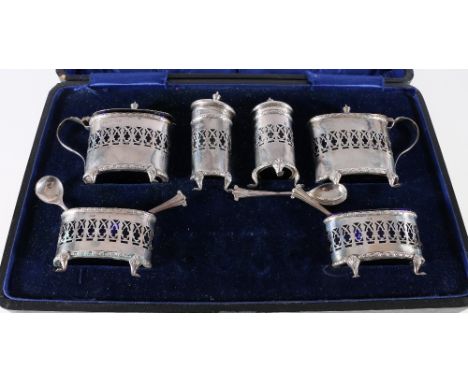 Victorian six piece silver cruet set with blue glass liners in fitted case, Birmingham 1893, maker J & C and four matched spo