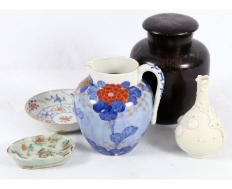 Group of Chinese and Japanese porcelain including a white glazed bottle vase, Canton dish, famille rose saucer, Arita jug, ca