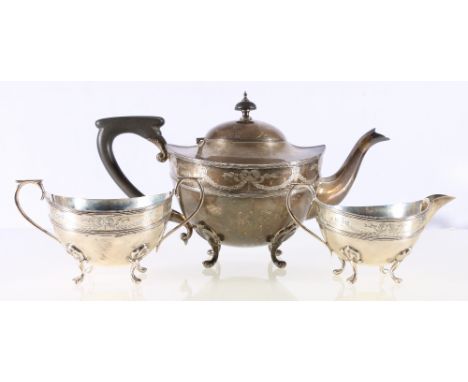 Silver three piece teaset of circular form, with ribbon and swag borders, Birmingham 1912, 826g gross.   CONDITION REPORT:  T