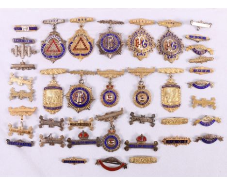 Group of eleven silver gilt enamel masonic medals, 294g, and various clasps.