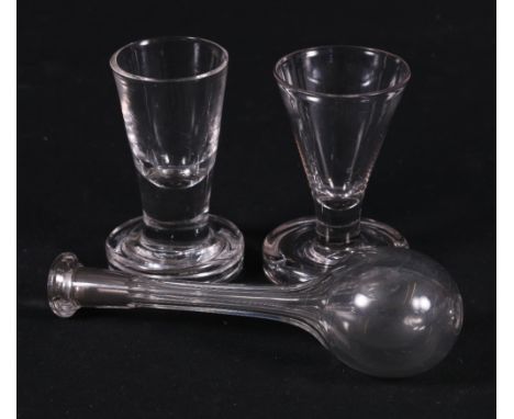 Early 19th century glass toddy lift with spherical body, 17cm and a pair of near matching firing glasses with trumpet shaped 