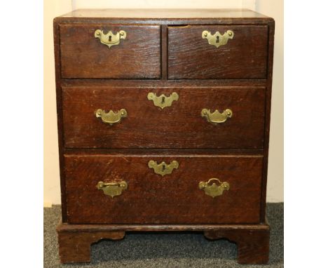 19th century oak chest of two short over two long graduated drawers, raised upon bracket supports, 57cm wide, 70cm tall, 43cm