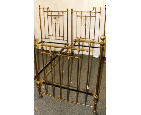 Pair of Victorian brass single beds with scroll headboards, 207cm x 100cm.   CONDITION REPORT:  Some wear to lacquer on brass