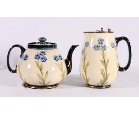 James Macintyre florian teapot, by Moorcroft, 12cm and matching jug, 15cm.   CONDITION REPORT:  Lid cracked.