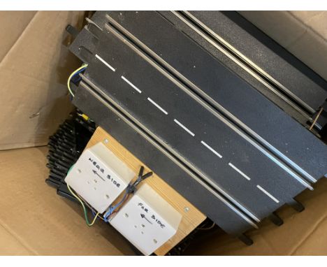 A large box (18.5KG) of Scalextric Track comprising straights, curves and power switch. Ex layout.