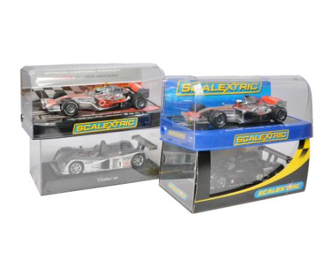 Scalextric slot car issues comprising Vodafone McLaren Mercedes, McLaren Mercedes MP4-21, Cadillac LMP plus Cadillac LMP . Al