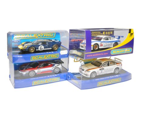 Scalextric slot car issues comprising BMW 320si WTCC(crack to display case), Ford GT40, Ferrari F430 GT plus Porsche GT3R. Al