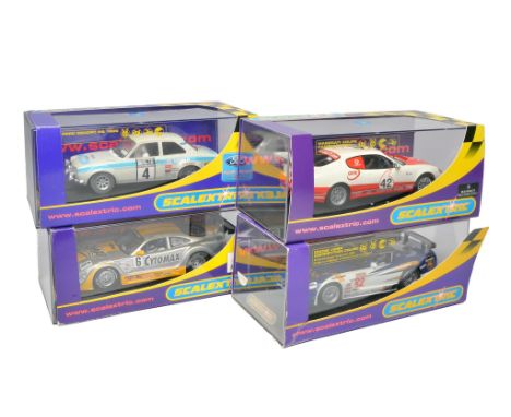 Scalextric slot car issues comprising Ford Escort RS 1600, Jaguar XKRS Cytosport, Maserati Coupe Cambio Corsa Trofeo 2003 plu