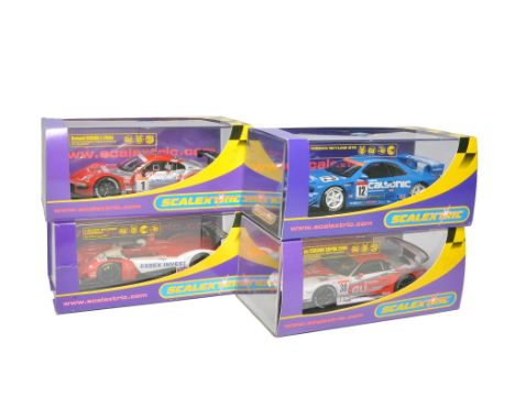 Scalextric slot car issues comprising Nissan Skyline GTR, au Cerumo Supra 2004, Xanavi Nismo Z no.1 plus Lister Storm LMF Le 