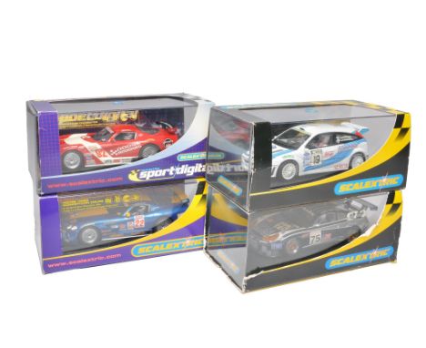 Scalextric slot car issues comprising Ford Focus WRC, Dodge Viper Competition Coupe (scuffs/storage wear to outer sleeve), Po
