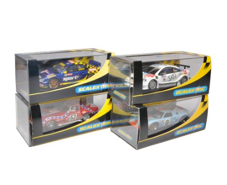 Scalextric slot car issues comprising Ford GT40, Opel V8 Coupe, Chevrolet Corvette L88 plus Subaru Impreza WRC. All appear to